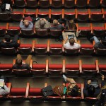 Overhead view of half-filled auditorium